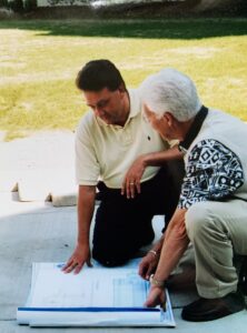 Copy of 2004 Paul Kazmieczak and George Weydman looking at blueprints for the Emanuel Gym